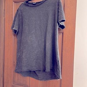 Buttercup Tee with cuts in back. Never worn but no tags. Brand new.